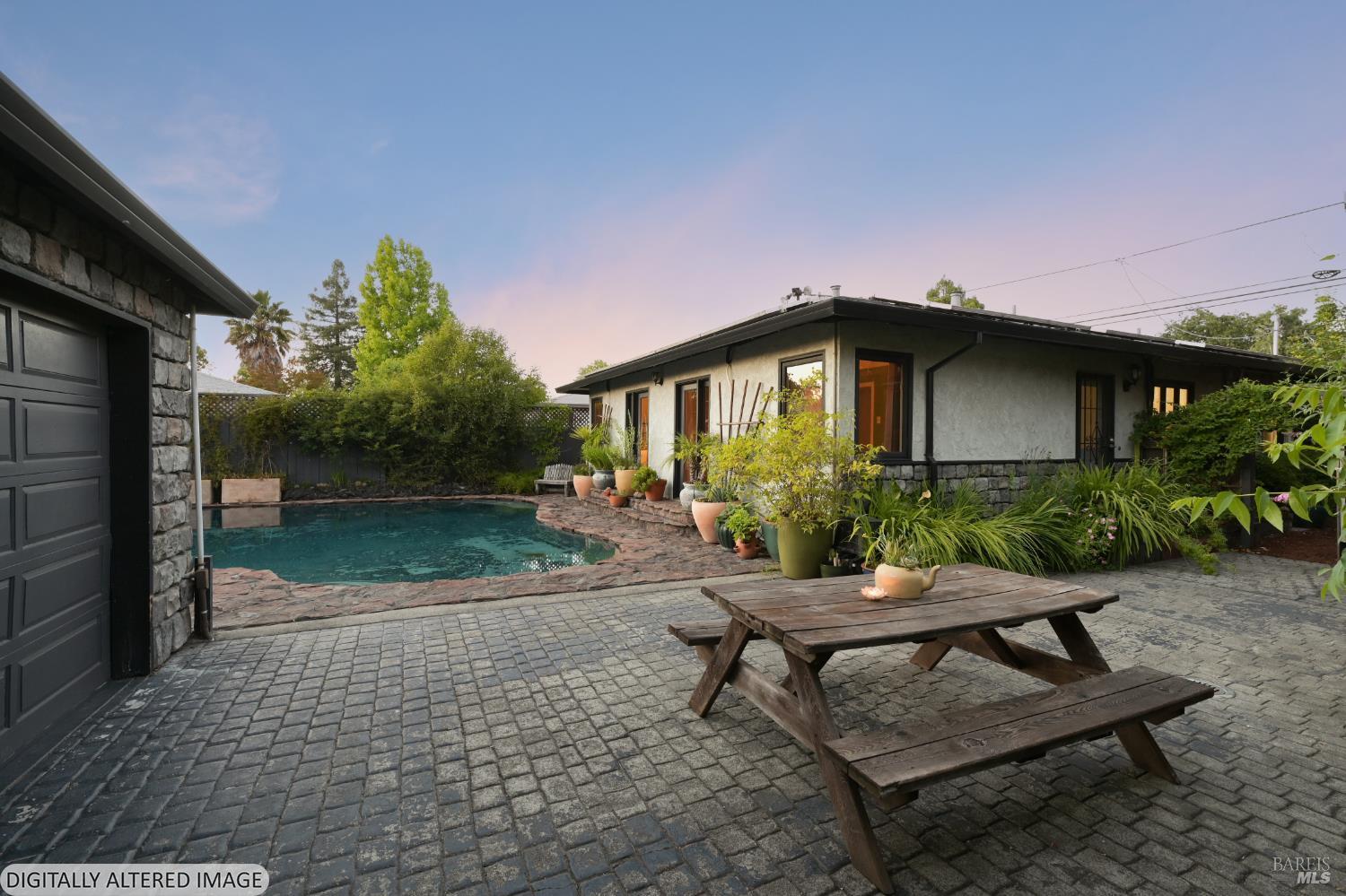 2111 Humboldt Street Santa Rosa, CA 95404 - Photo 23 of 27 Cobblestone pavers extend for entertaining areas. The extra long, gated driveway allows parking for multiple cars.