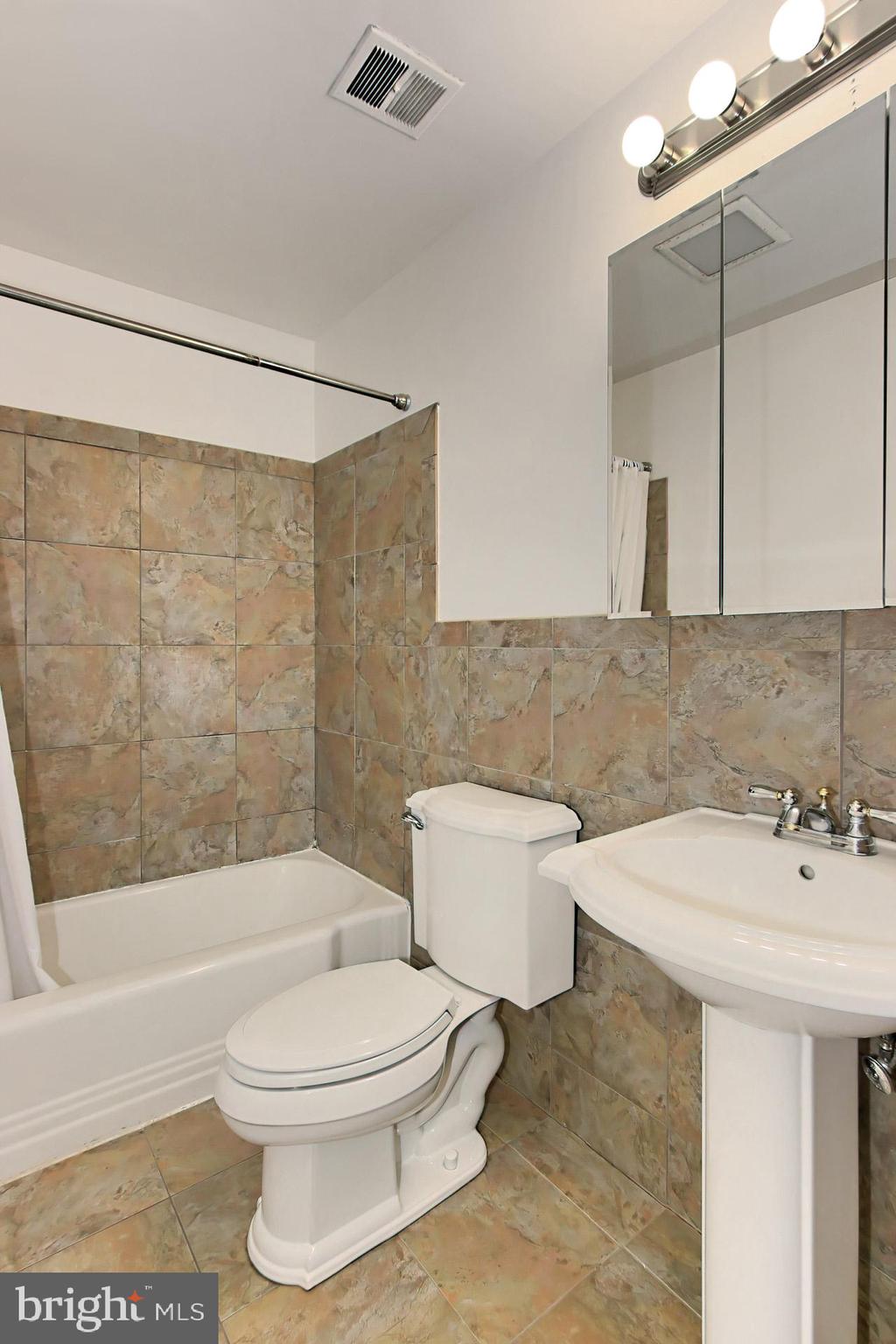 6305 Gormley Place Springfield, VA 22152 - Photo 26 of 66 Hall bathroom nicely updated