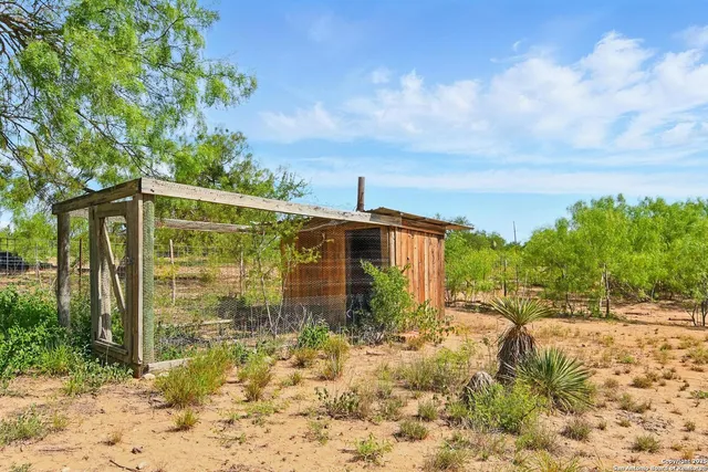 a view of a pathway in front of house