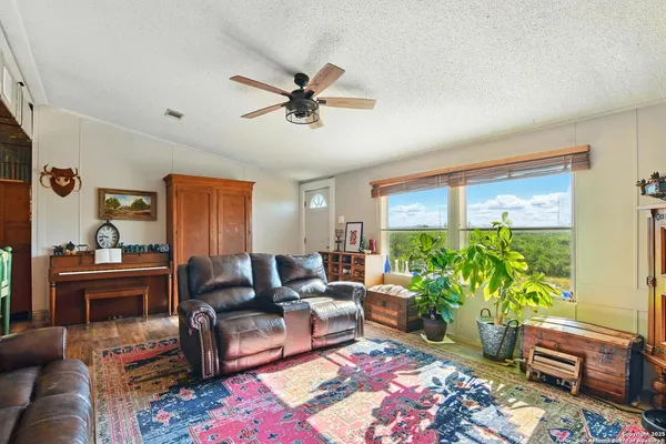 a living room with furniture and a window