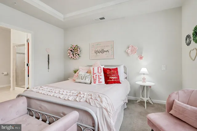 a bedroom with a bed and a couch