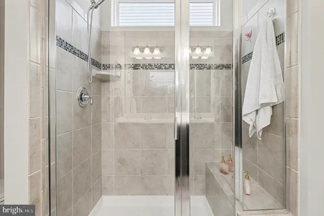 a bathroom with a glass shower door