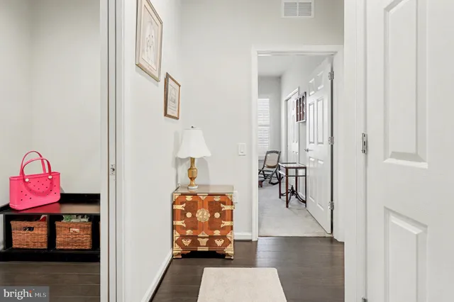 a bedroom with a bed and a book shelf