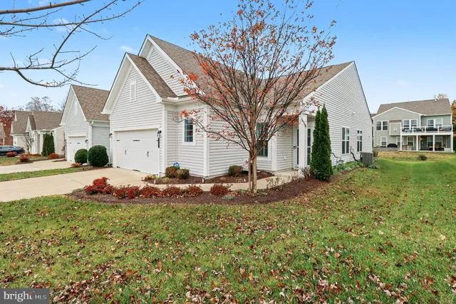 a living room with fireplace furniture and a flat screen tv
