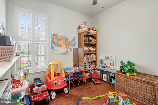 a view of a patio with a dining table and chairs