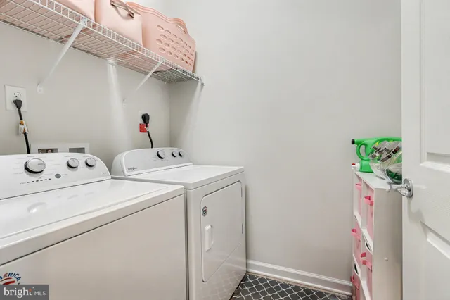 a view of a patio with a table and chairs
