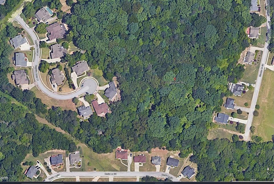 1210 Buckner Road Mableton, GA 30126 - Photo 2 of 2 an aerial view of a house with a yard and lake view