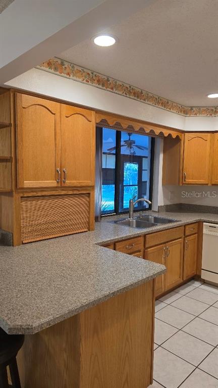 70 Furness Place Palm Coast, FL 32137 - Photo 23 of 30 a kitchen with stainless steel appliances granite countertop a sink and a counter space
