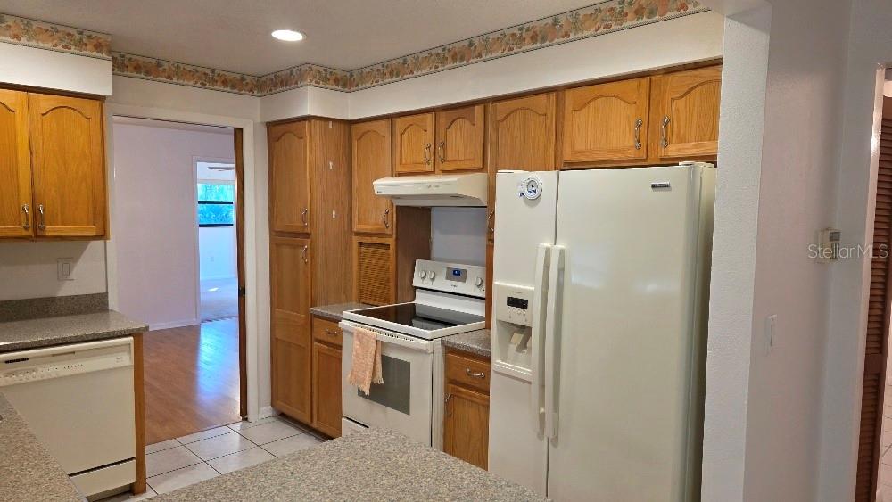 70 Furness Place Palm Coast, FL 32137 - Photo 24 of 30 a kitchen with stainless steel appliances a refrigerator and a stove