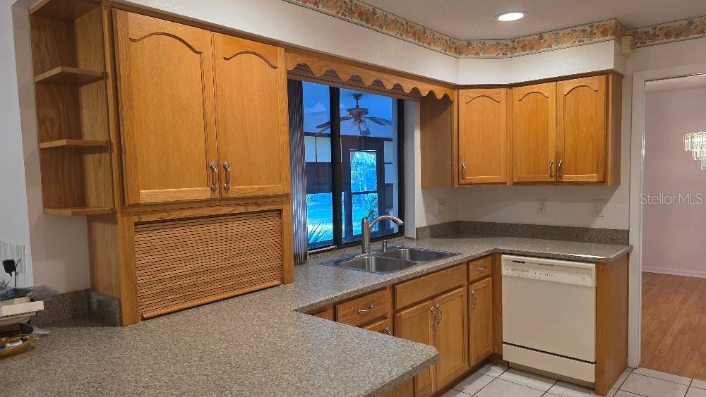 70 Furness Place Palm Coast, FL 32137 - Photo 25 of 30 a kitchen that has a sink and a large window