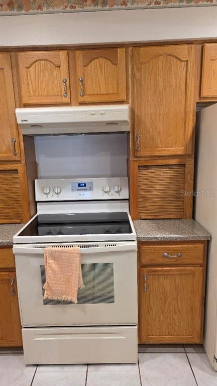 70 Furness Place Palm Coast, FL 32137 - Photo 26 of 30 a stove top oven sitting inside of a kitchen