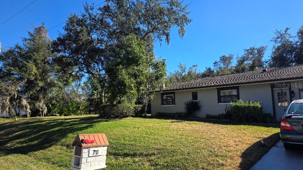70 Furness Place Palm Coast, FL 32137 - Photo 3 of 30 a backyard of a house with lots of green space