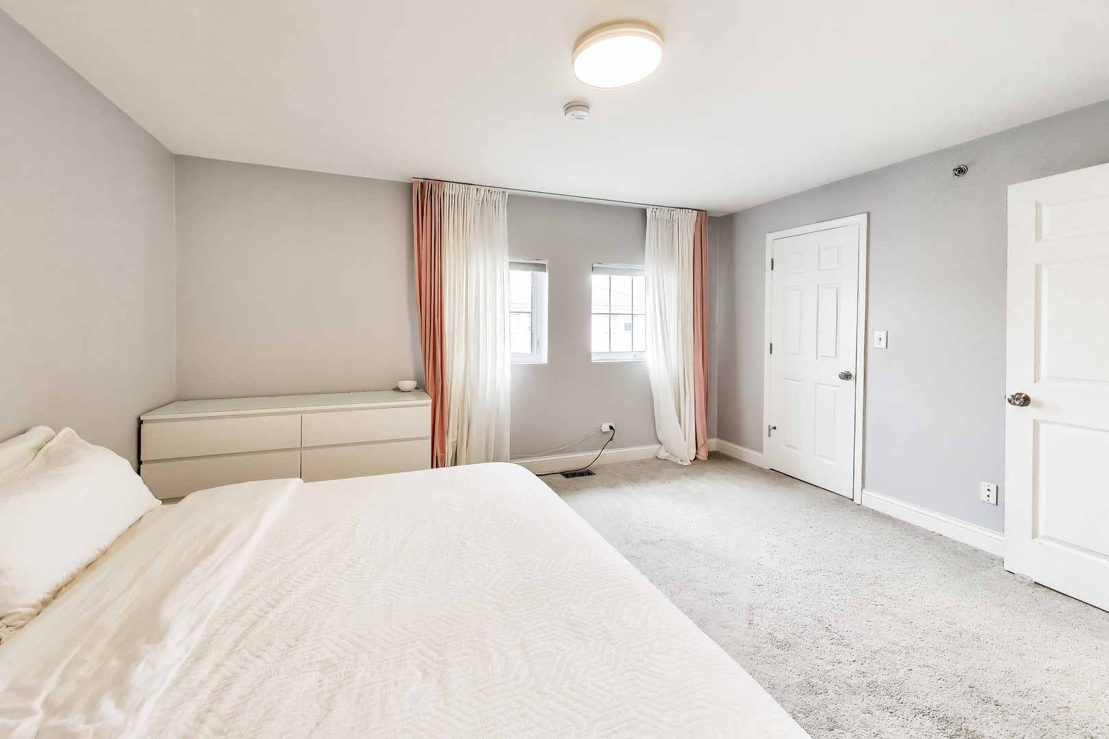 183 East River Road, Unit A3 Des Plaines, IL 60016 - Photo 11 of 21 a large white bed in a white room