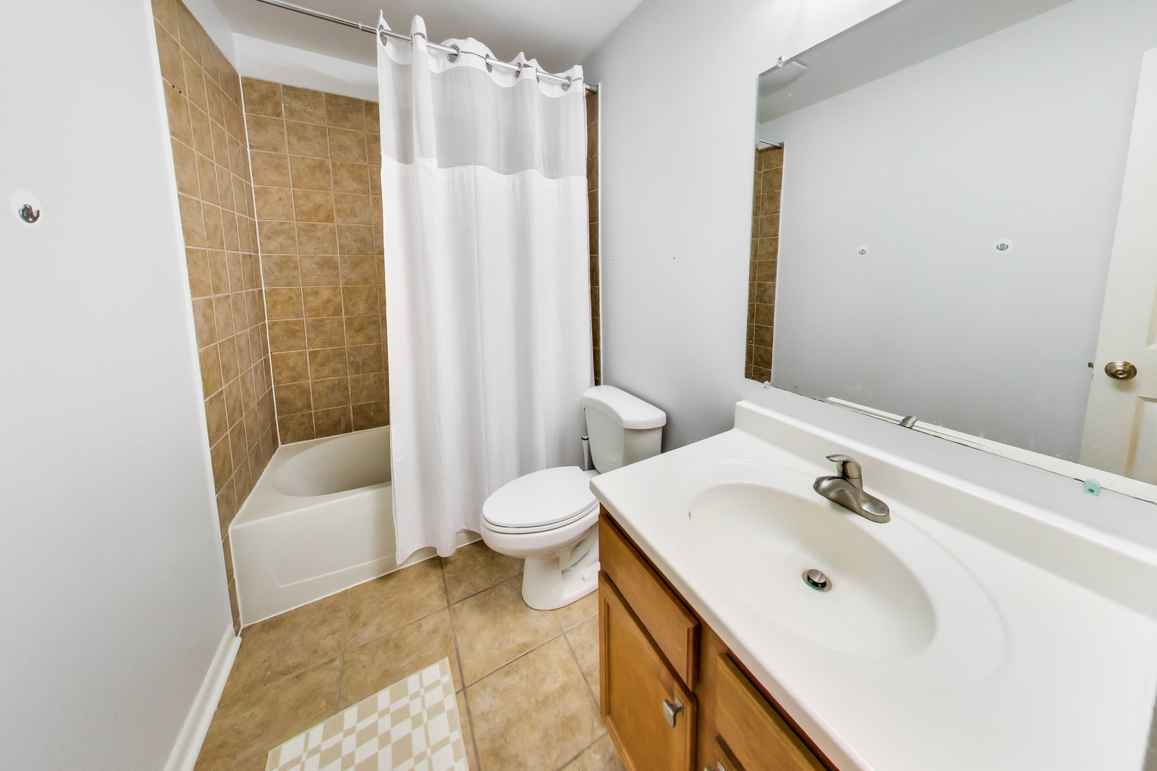 183 East River Road, Unit A3 Des Plaines, IL 60016 - Photo 14 of 21 a bathroom with a sink and a mirror