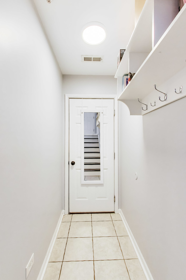 183 East River Road, Unit A3 Des Plaines, IL 60016 - Photo 20 of 21 a view of a hallway view with staircase