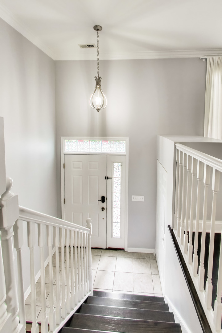 183 East River Road, Unit A3 Des Plaines, IL 60016 - Photo 2 of 21 a view of a hallway with entryway with wooden floor