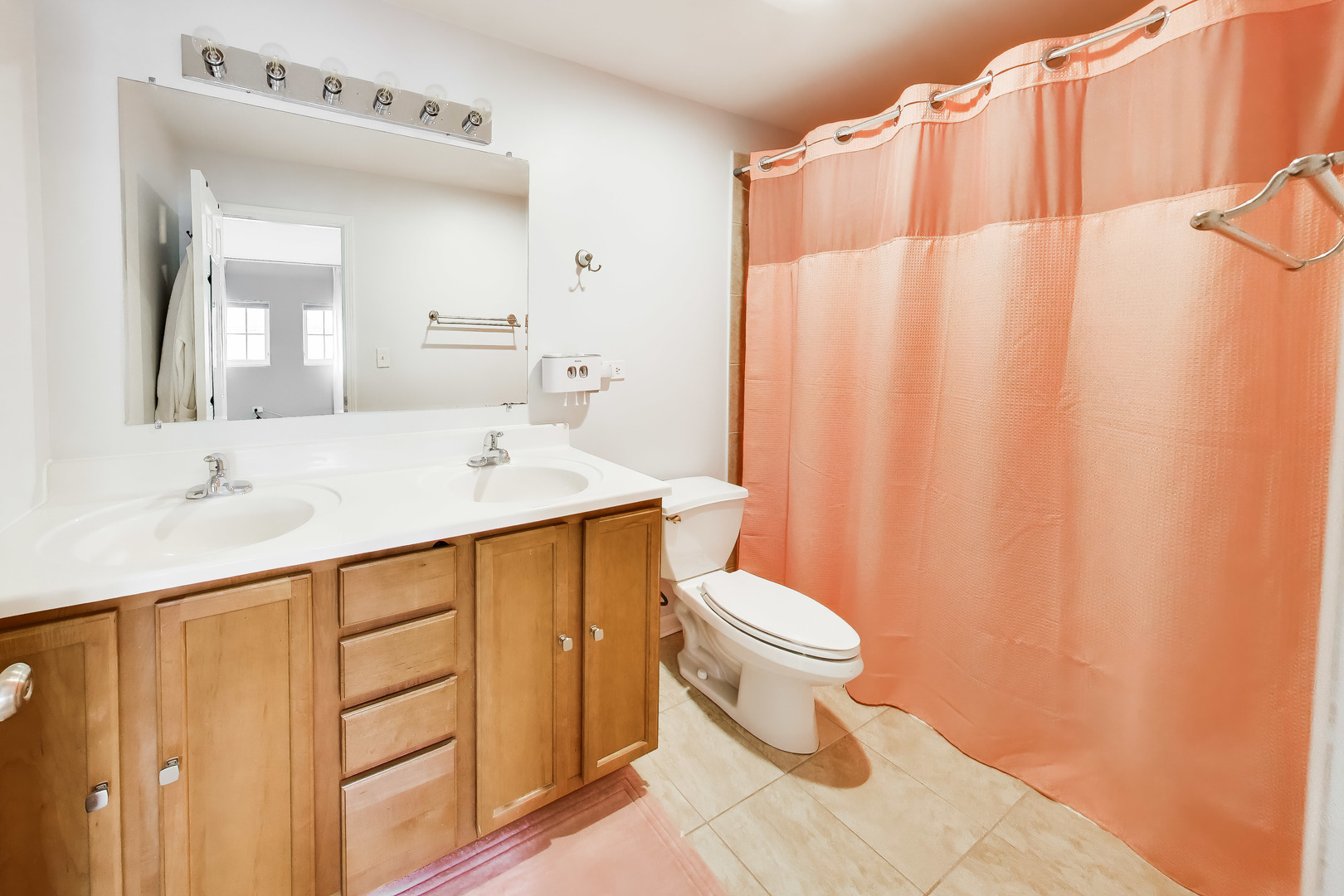 183 East River Road, Unit A3 Des Plaines, IL 60016 - Photo 9 of 21 a bathroom with a sink a toilet and shower curtain