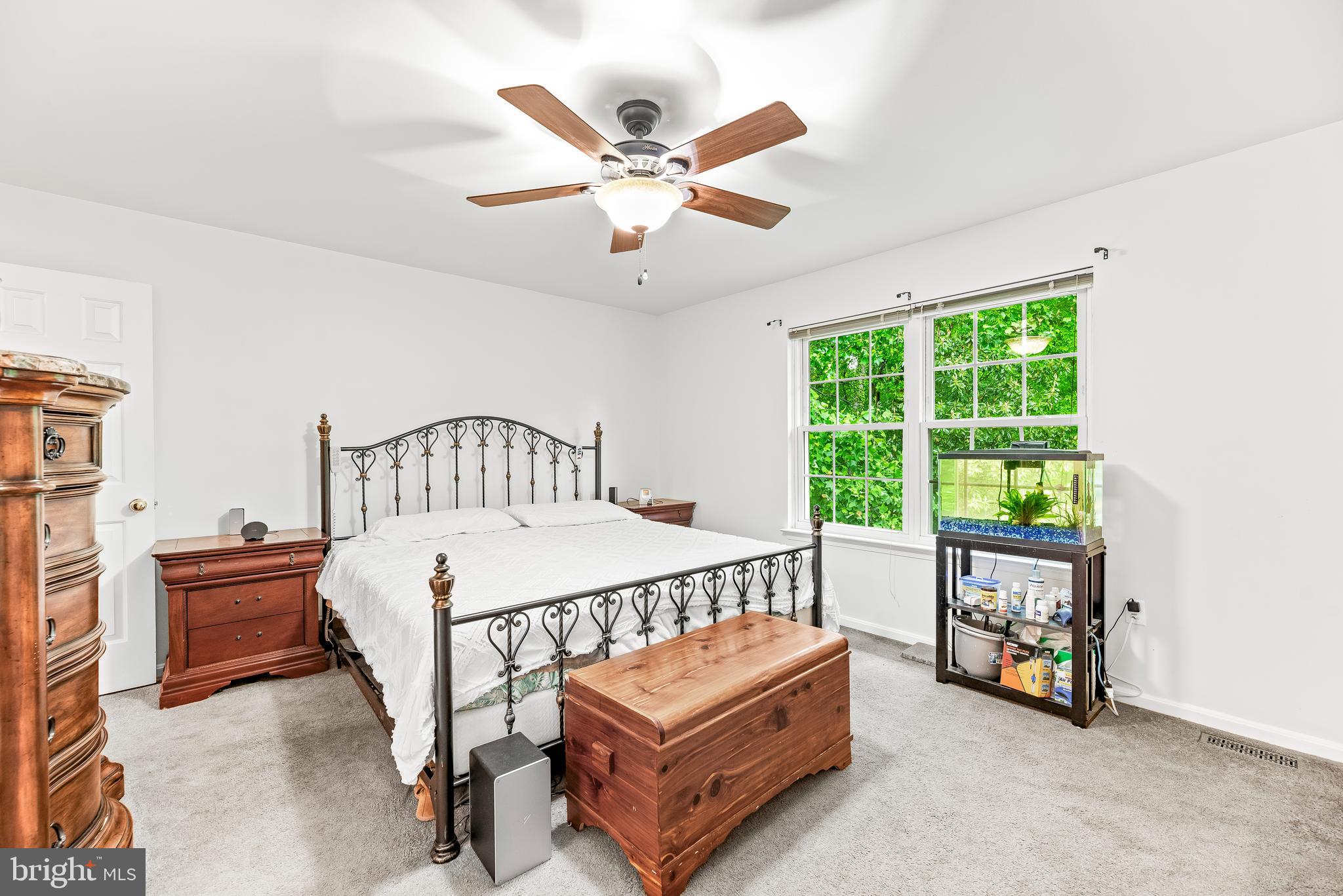 8328 Ridge View Road Lusby, MD 20657 - Photo 13 of 34 a bedroom with a bed and a large window