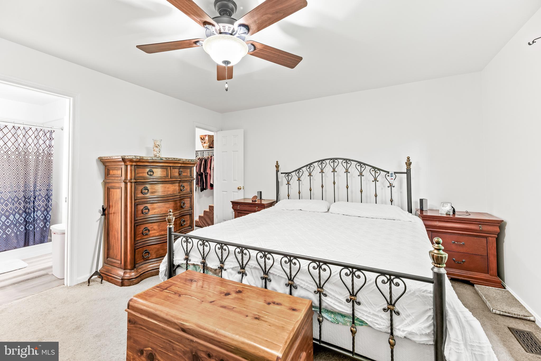 8328 Ridge View Road Lusby, MD 20657 - Photo 14 of 34 a bedroom with a bed and a dresser