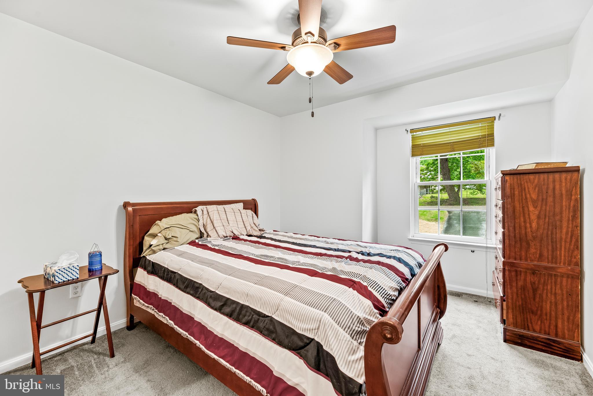 8328 Ridge View Road Lusby, MD 20657 - Photo 17 of 34 a bedroom with a bed and a window
