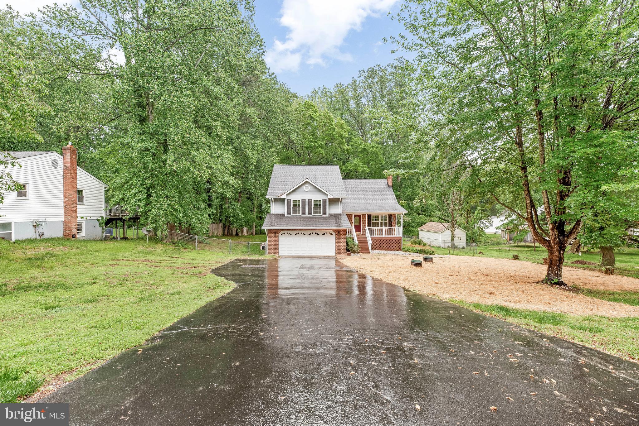 8328 Ridge View Road Lusby, MD 20657 - Photo 2 of 34 a view of a house with a yard