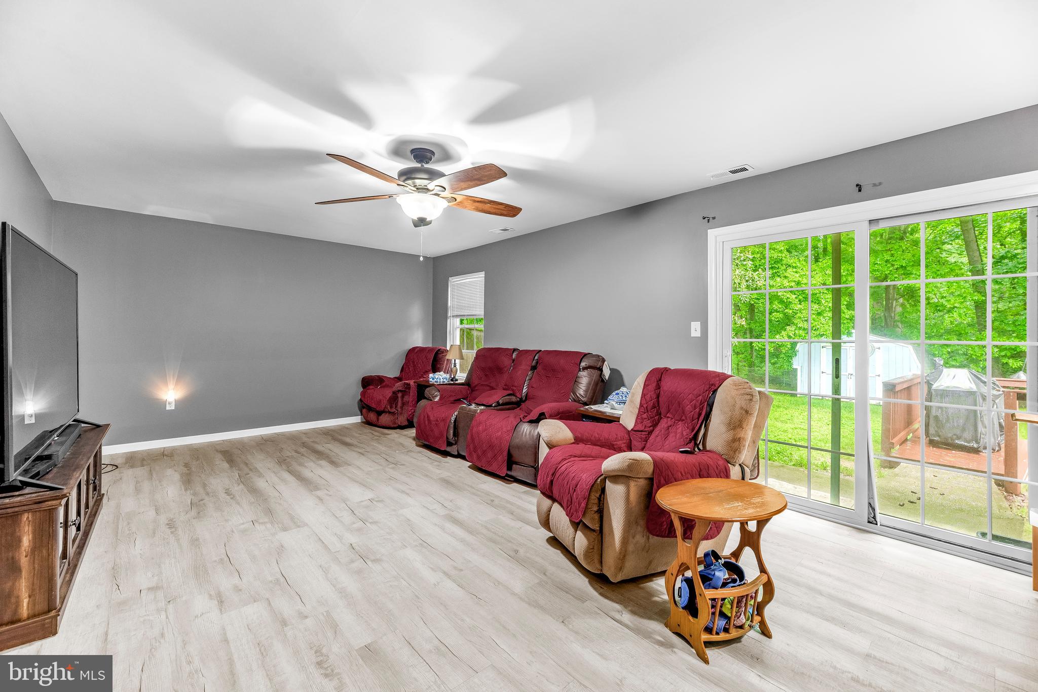 8328 Ridge View Road Lusby, MD 20657 - Photo 21 of 34 a living room with furniture and a large window