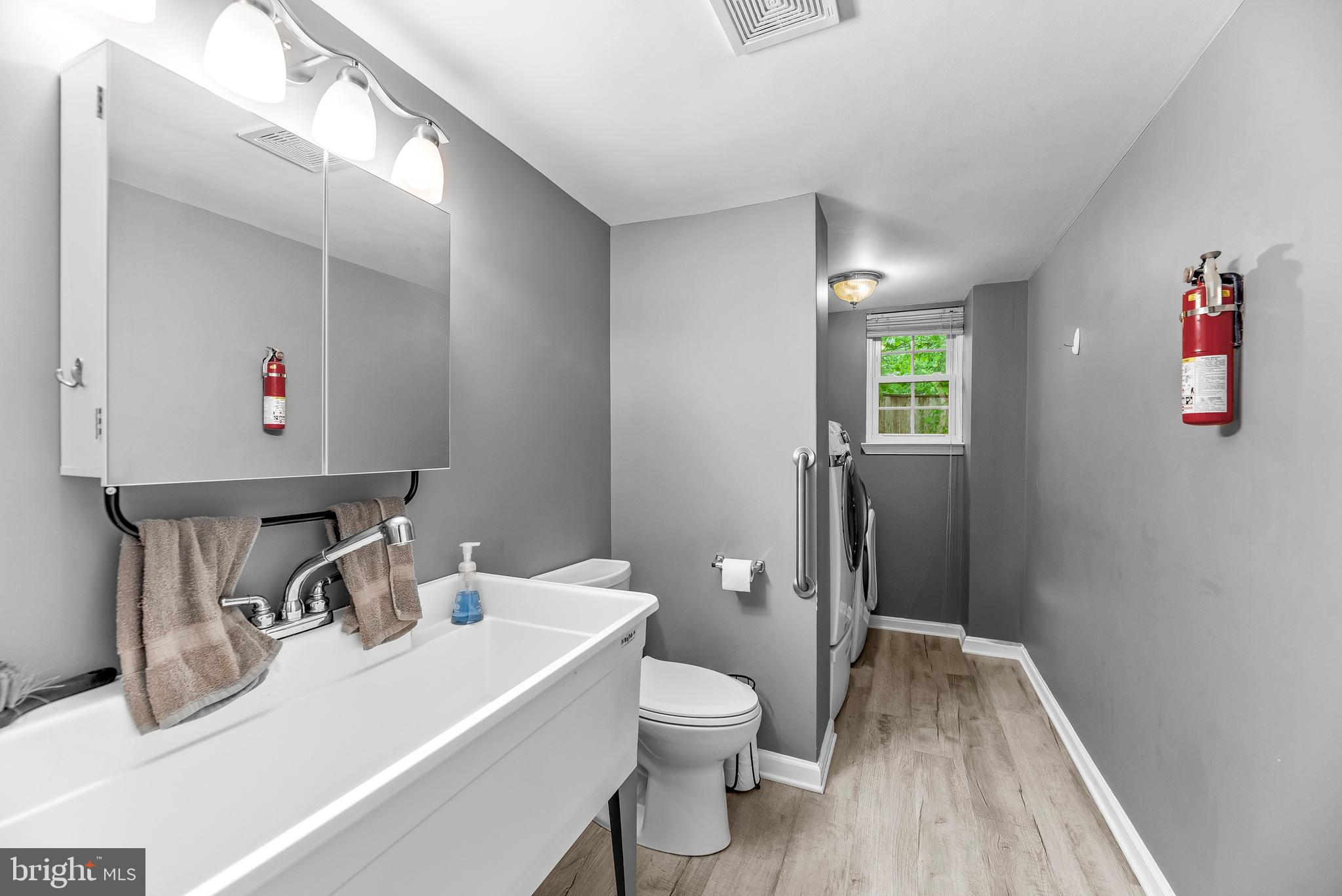 8328 Ridge View Road Lusby, MD 20657 - Photo 24 of 34 a bathroom with a sink toilet and shower