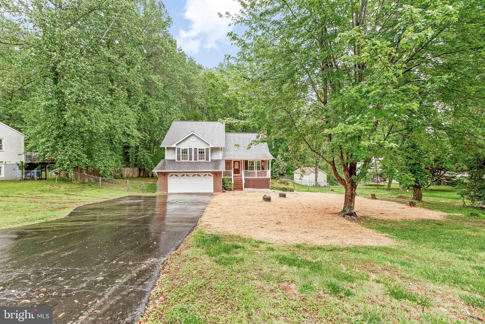 8328 Ridge View Road Lusby, MD 20657 - Photo 3 of 34 a view of a house with a yard
