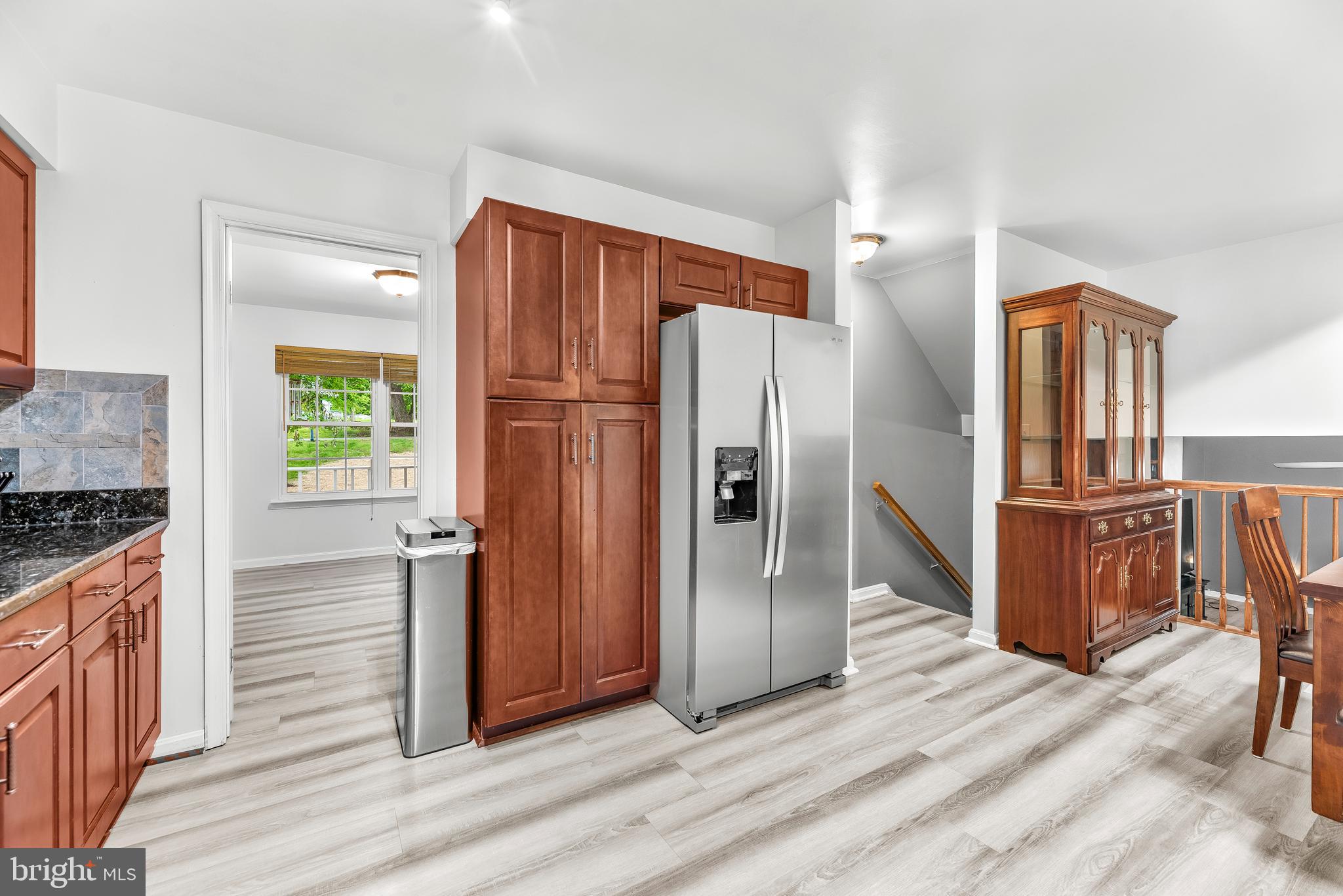 8328 Ridge View Road Lusby, MD 20657 - Photo 10 of 34 a kitchen with stainless steel appliances granite countertop a refrigerator and a stove