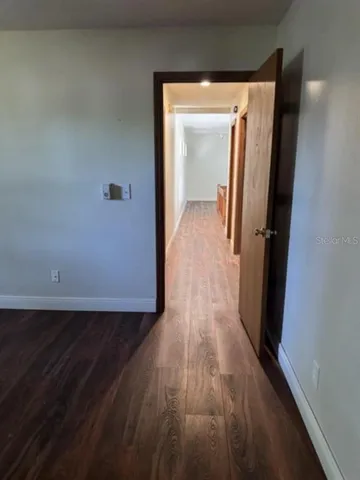 a view of living room with furniture and a window