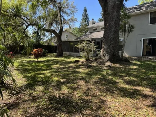a view of a yard in front of the house