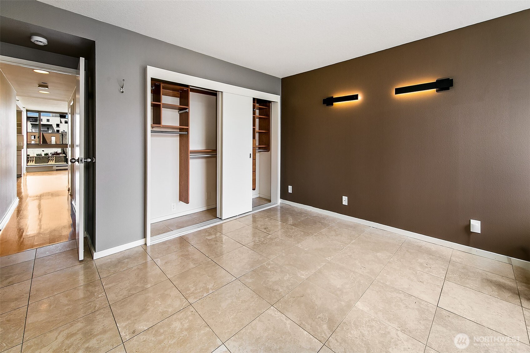 1101 Seneca Street, Unit 1301 Seattle, WA 98101 - Photo 14 of 40 a view of an empty room with closet and wooden floor
