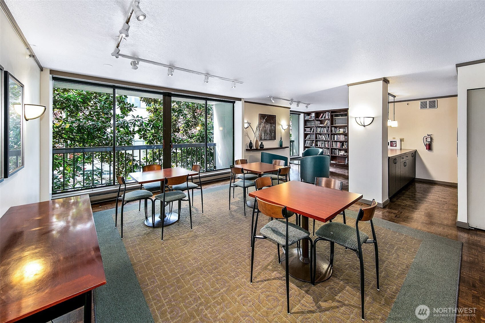 1101 Seneca Street, Unit 1301 Seattle, WA 98101 - Photo 31 of 40 a dining room with furniture and wooden floor