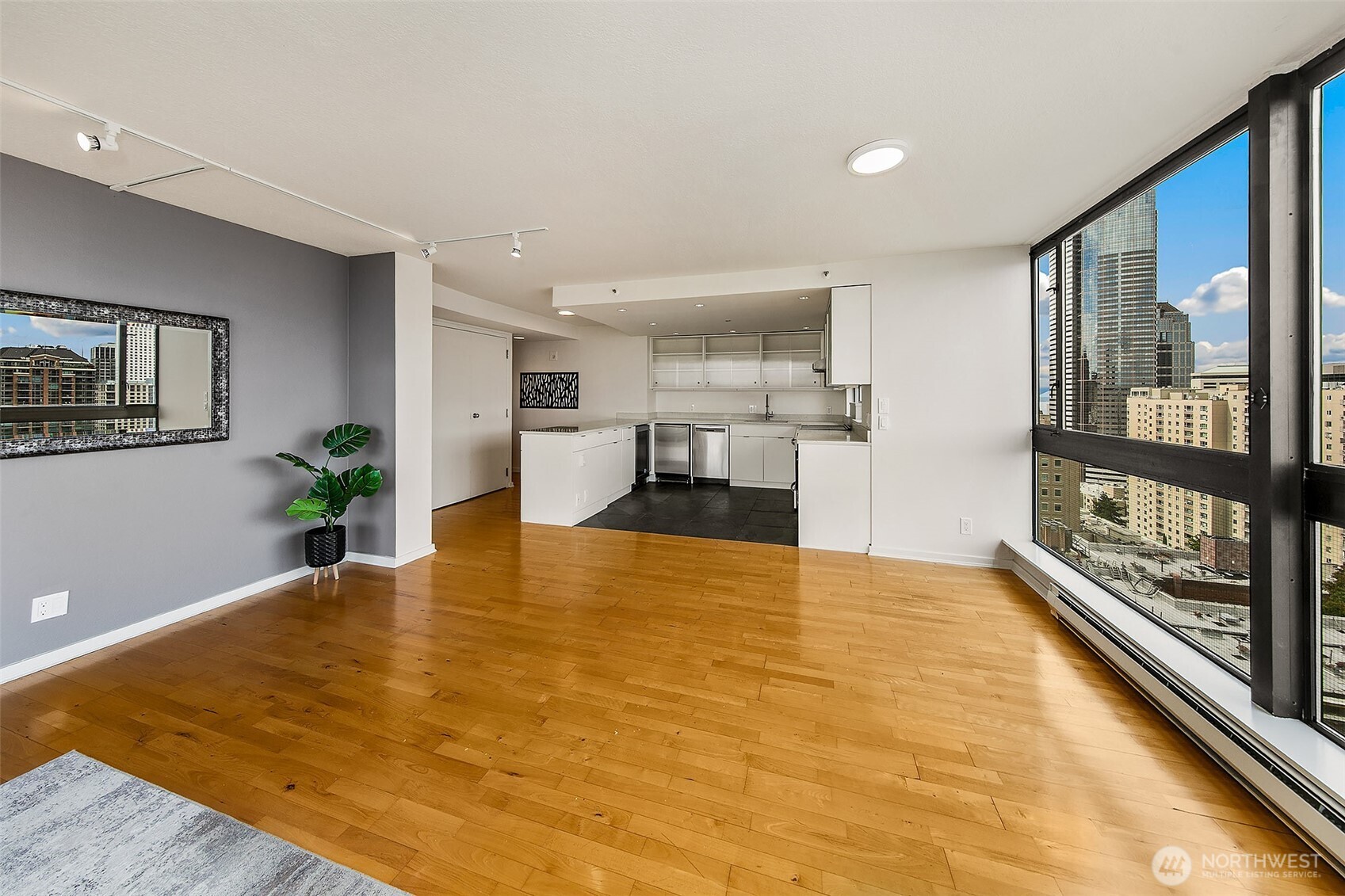 1101 Seneca Street, Unit 1301 Seattle, WA 98101 - Photo 7 of 40 a view of kitchen with furniture and wooden floor