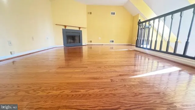 a white toilet sitting next to a shower curtain