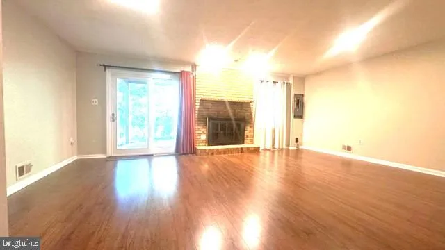 a view of a balcony with wooden floor
