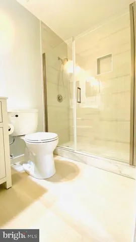 a view of an empty room with glass door