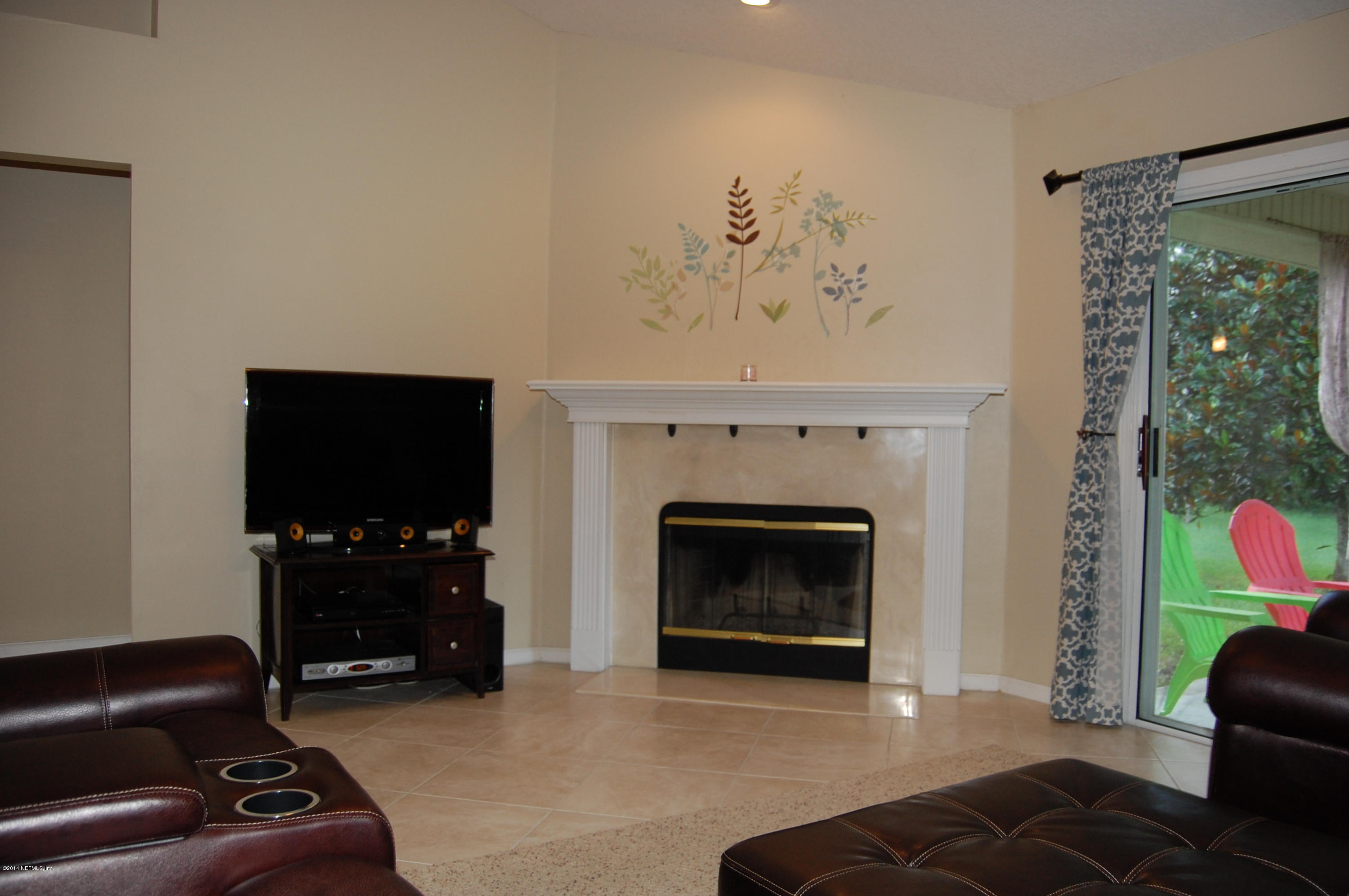 404 Spring Ridge Court St. Augustine, FL 32092 - Photo 15 of 31 a living room with furniture and a fireplace