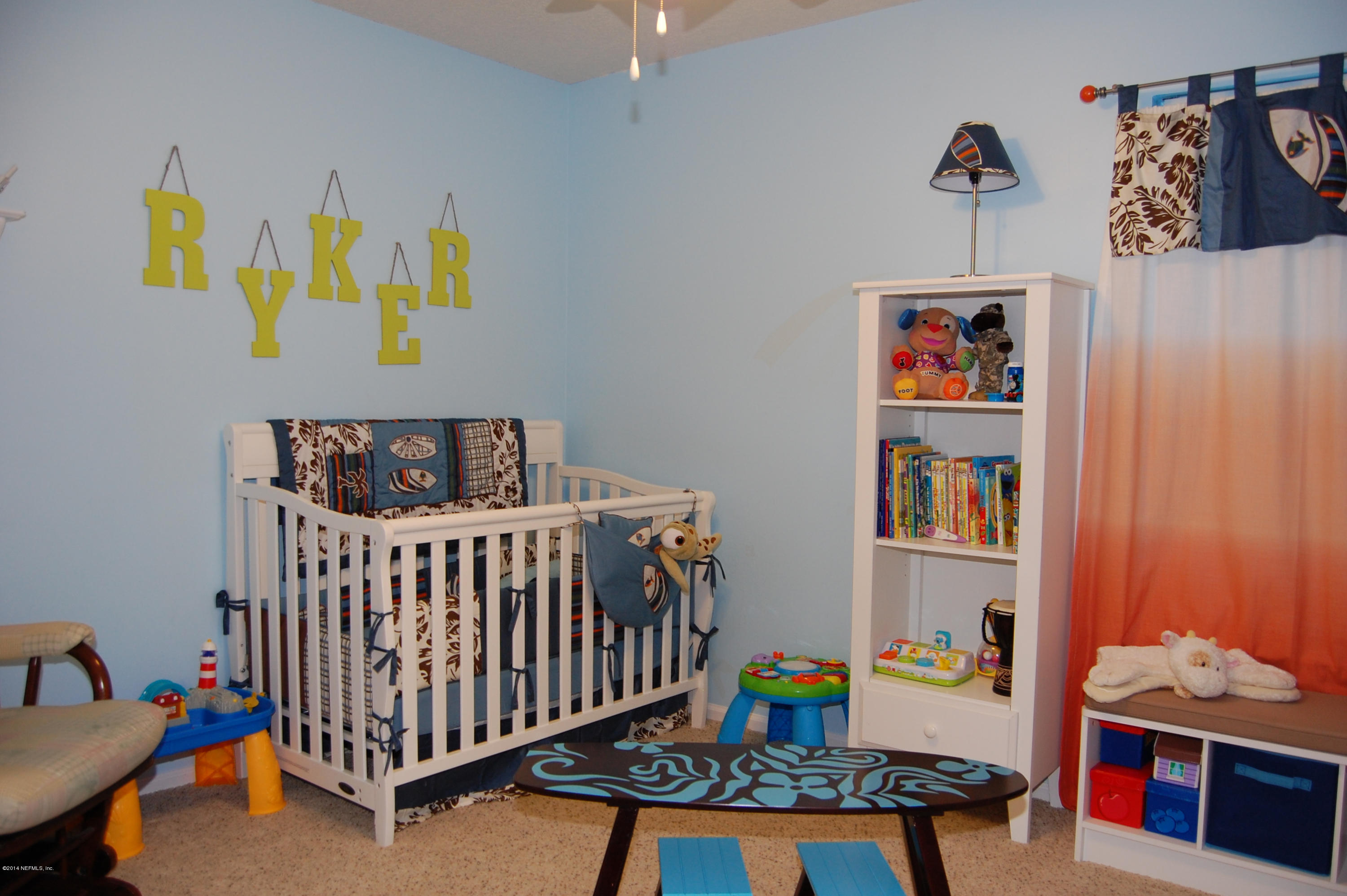 404 Spring Ridge Court St. Augustine, FL 32092 - Photo 16 of 31 a bedroom with baby crib and hanging chair