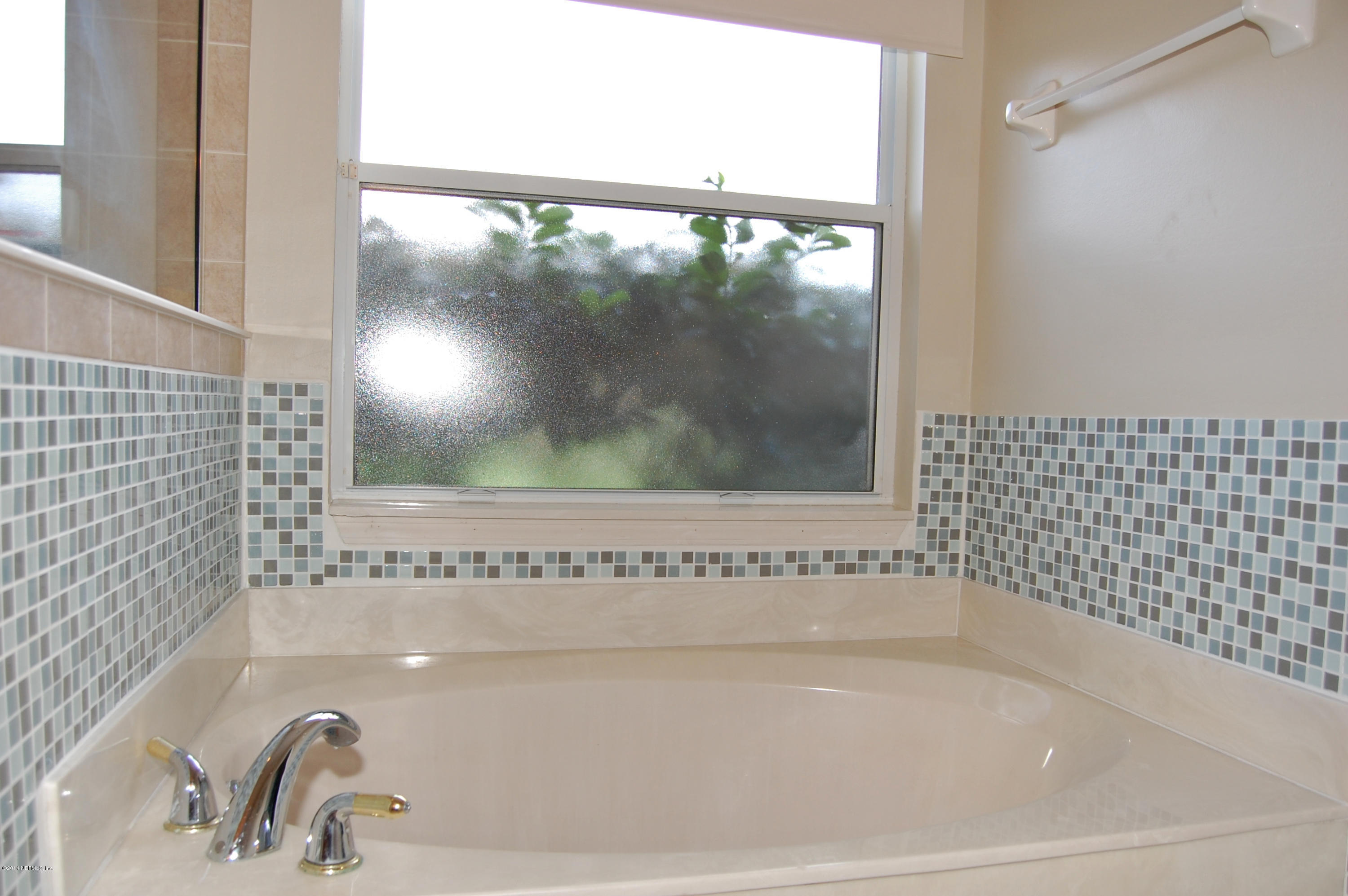 404 Spring Ridge Court St. Augustine, FL 32092 - Photo 22 of 31 a bathroom with a bathtub and shower