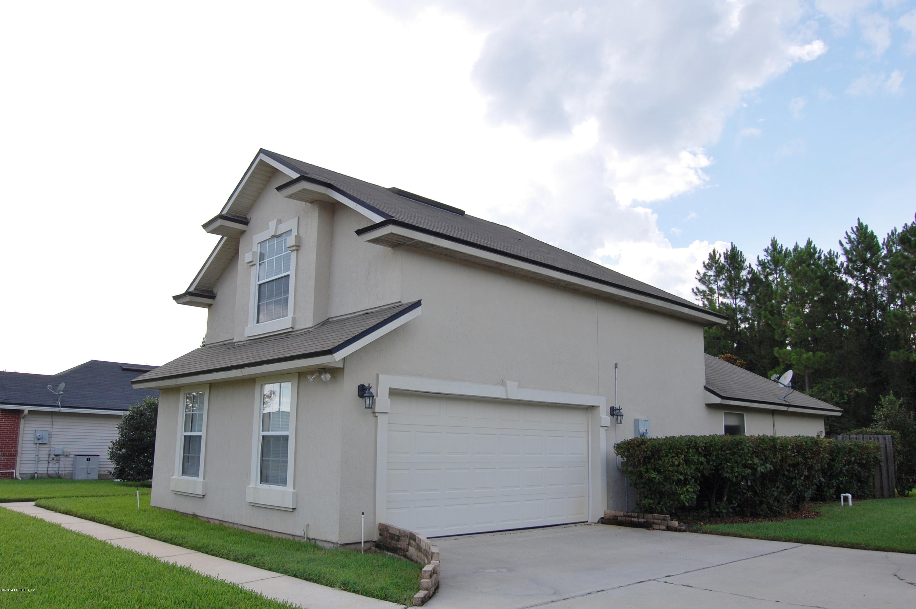 404 Spring Ridge Court St. Augustine, FL 32092 - Photo 25 of 31 a house view with a backyard space