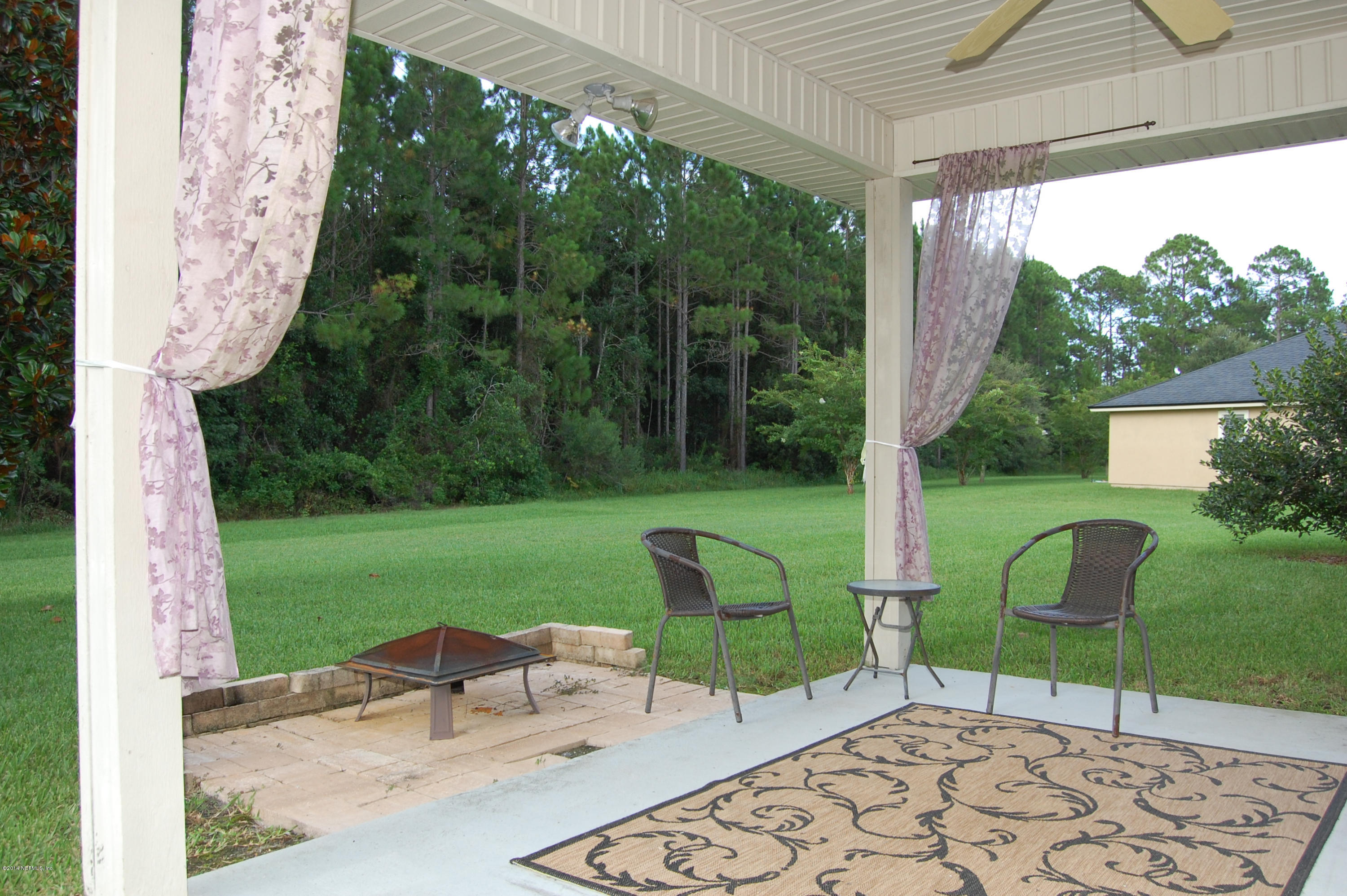404 Spring Ridge Court St. Augustine, FL 32092 - Photo 27 of 31 a garden view with a seating space