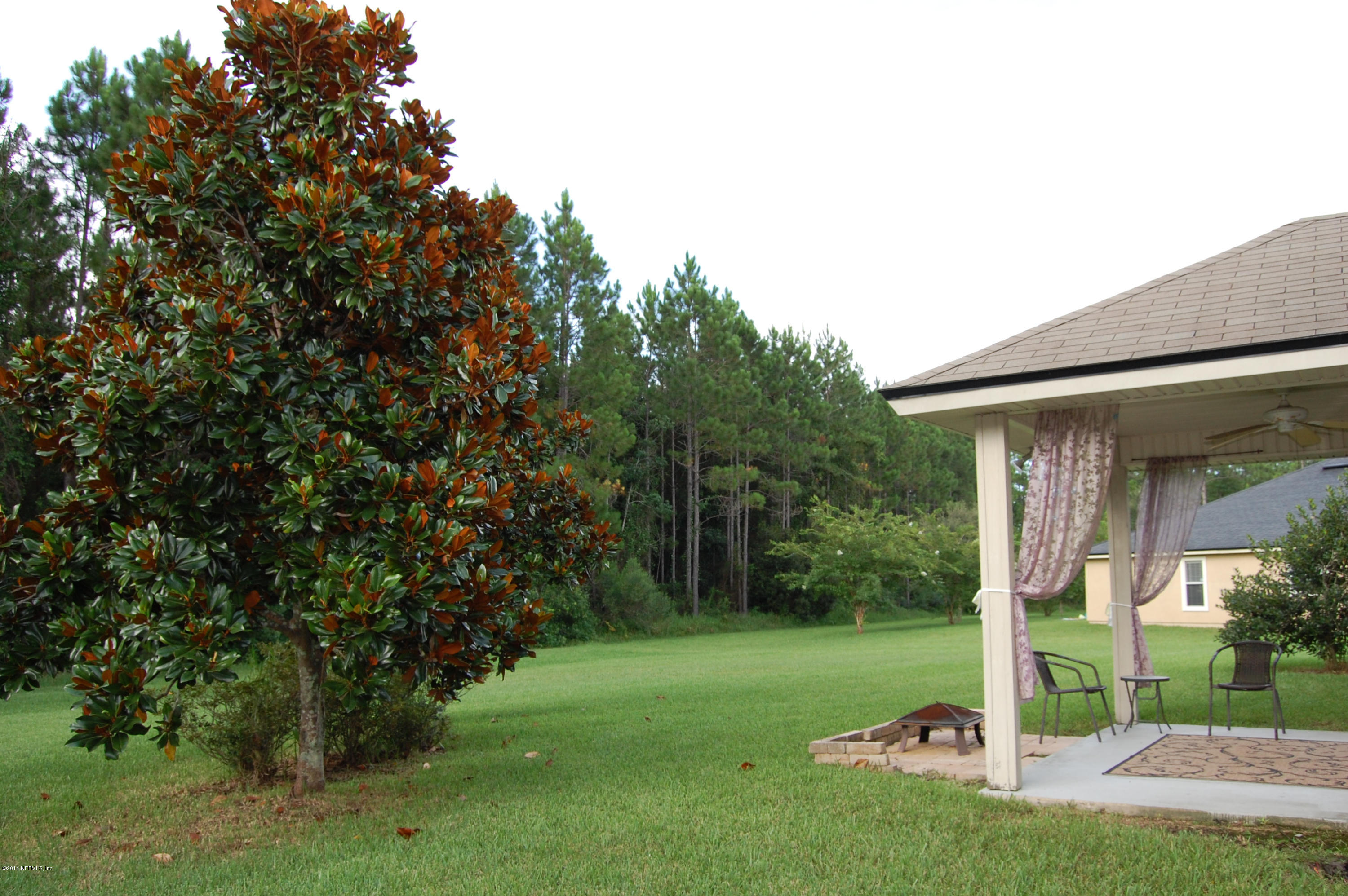 404 Spring Ridge Court St. Augustine, FL 32092 - Photo 28 of 31 a front view of a house with garden