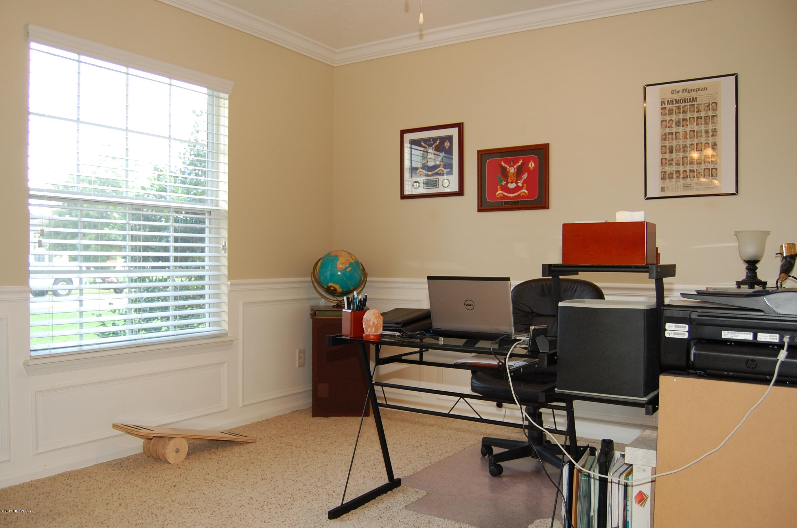 404 Spring Ridge Court St. Augustine, FL 32092 - Photo 6 of 31 a view of a workspace with furniture and a window