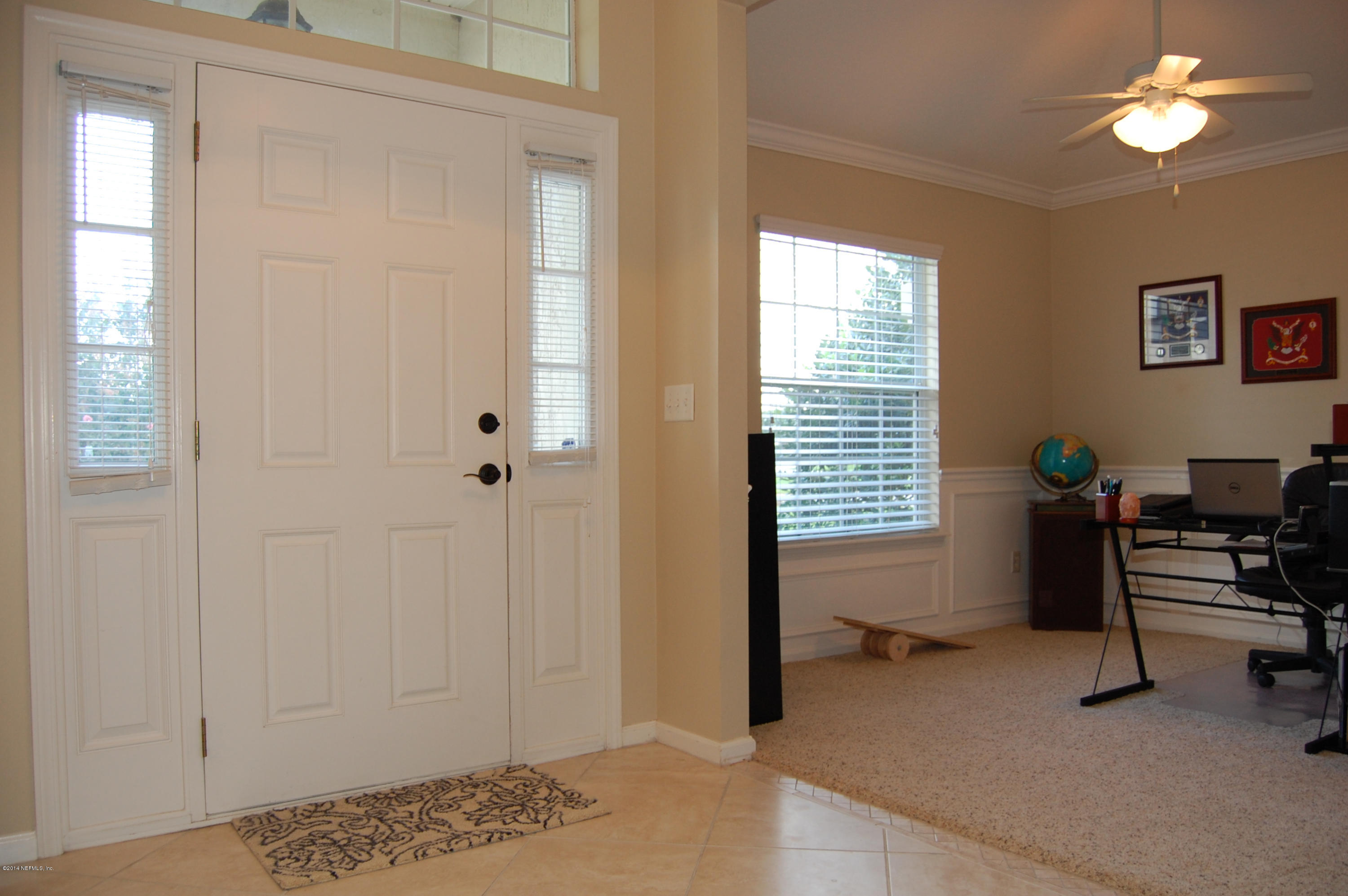 404 Spring Ridge Court St. Augustine, FL 32092 - Photo 7 of 31 a view of a workspace with furniture and a window