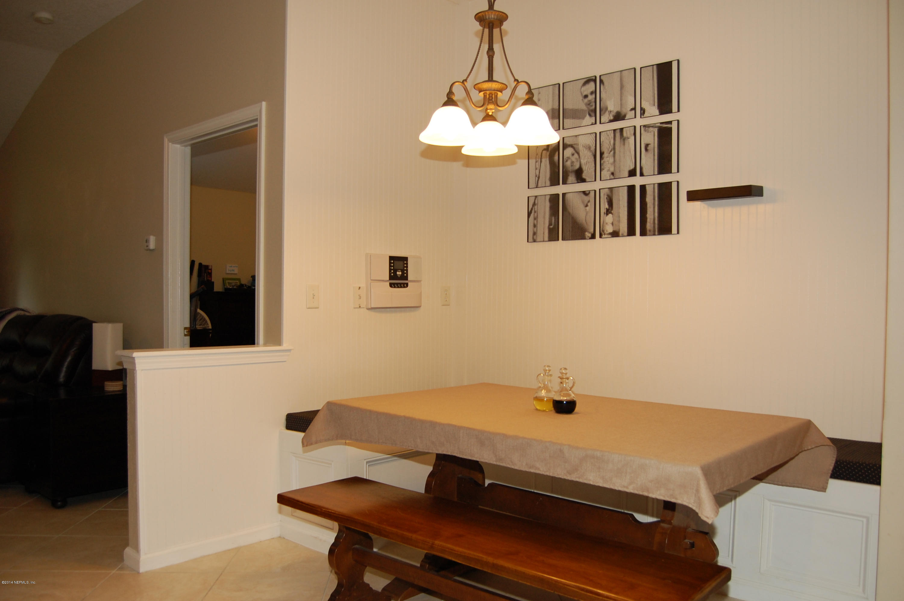 404 Spring Ridge Court St. Augustine, FL 32092 - Photo 8 of 31 a room with table and chair