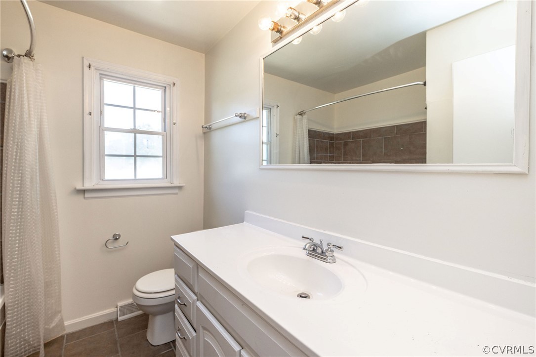4300 Milsmith Road Chester, VA 23831 - Photo 19 of 27 a bathroom with a sink and a toilet