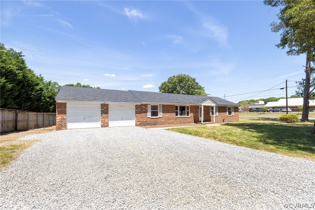 4300 Milsmith Road Chester, VA 23831 - Photo 26 of 27 a front view of a house with a yard and garage