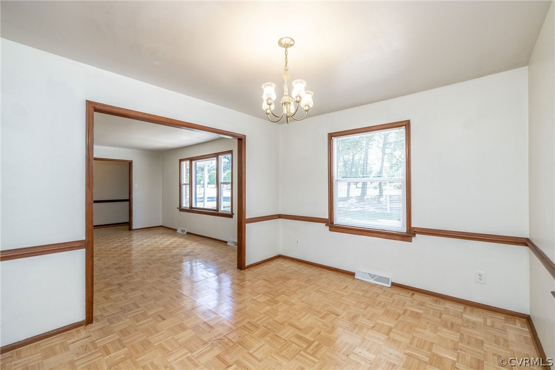 4300 Milsmith Road Chester, VA 23831 - Photo 5 of 27 an empty room with chandelier fan and windows
