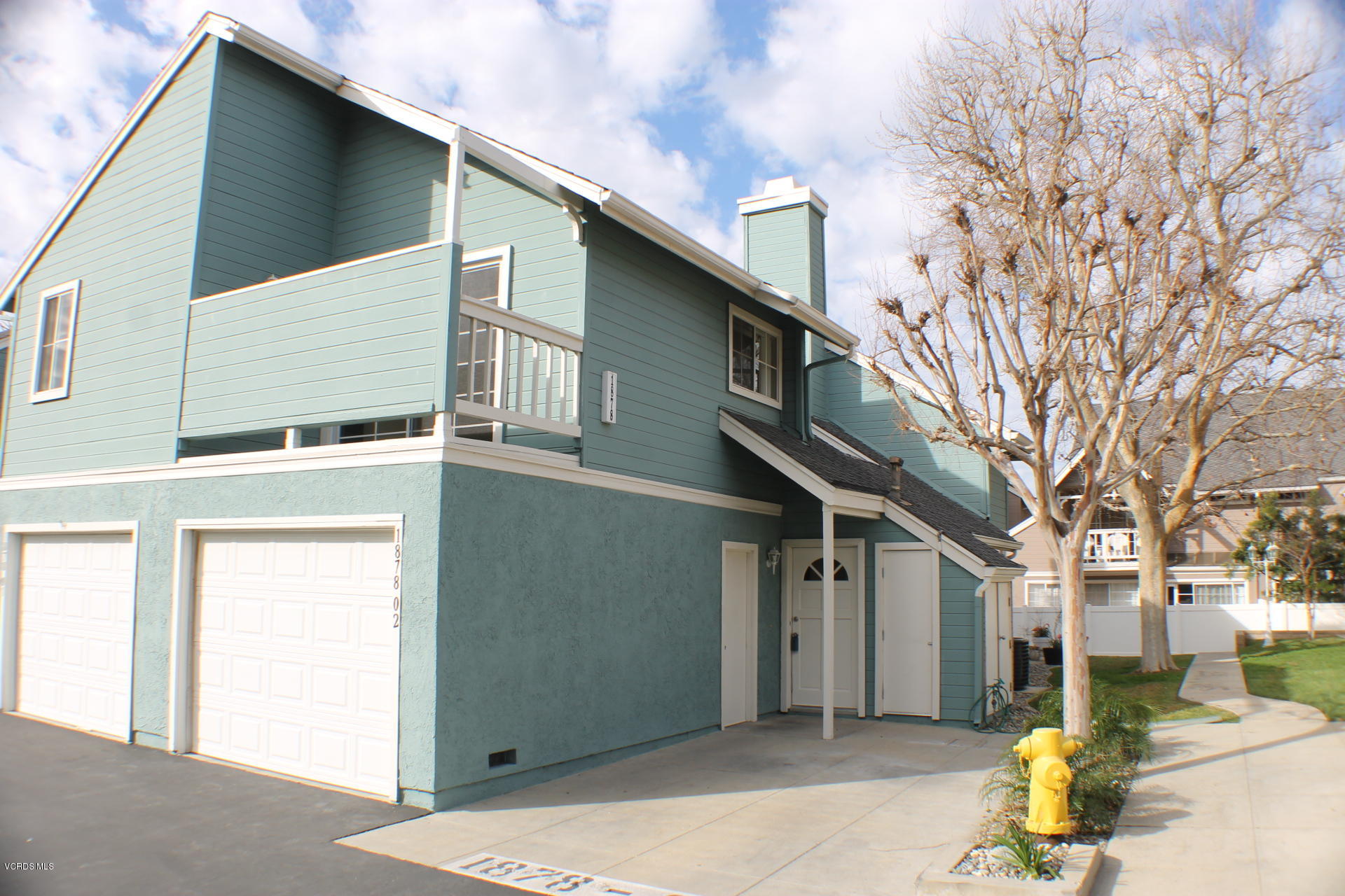 1878 Rory Lane, Unit 2 Simi Valley, CA 93063 - Photo 1 of 30 a view of a house with a large tree